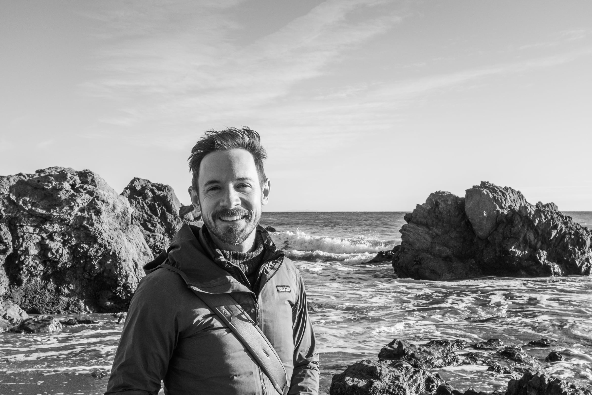Joey Kantor on a rocky shoreline